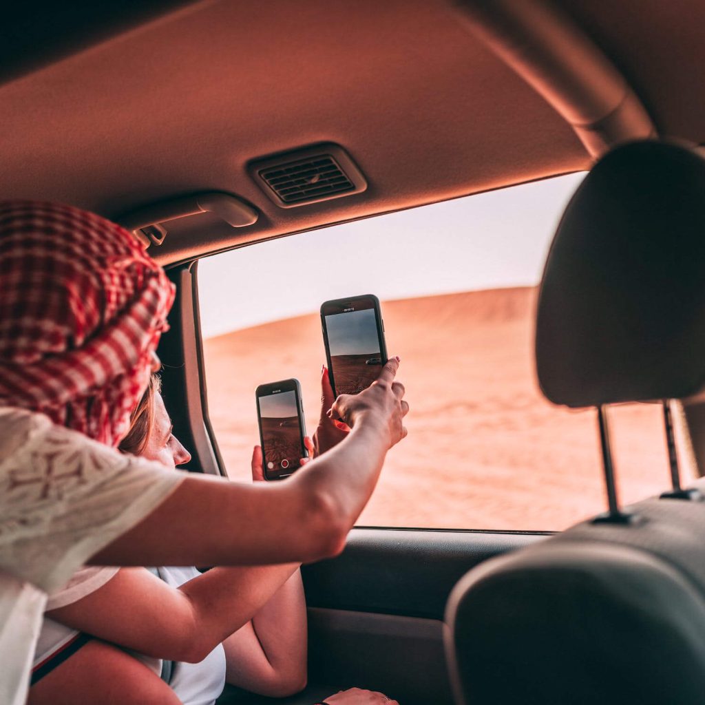 Couple Taking pictures in Desert Safari Dune bashing